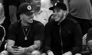 liangelo and lonzo ball smiling and laughing at a basketball game