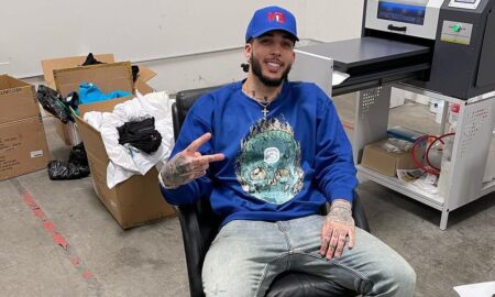 liangelo ball smiling in mb1 hat and blue bbb tshirt