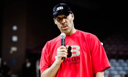 lavar ball holding a microphone and talking