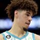 LaMelo stares to the ground