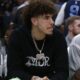LaMelo watches from the sideline