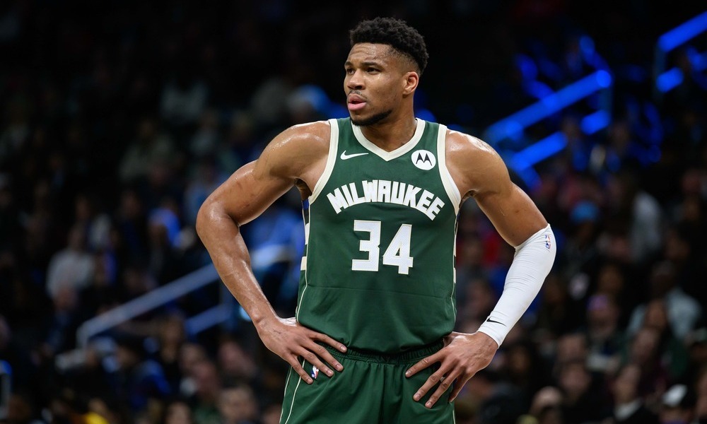 Giannis catches his breath as he waits for play to continue.