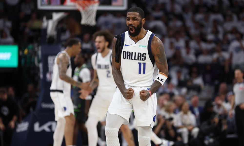 Kyrie Irving celebrating after making a tough shot during the 2024 NBA Playoffs.