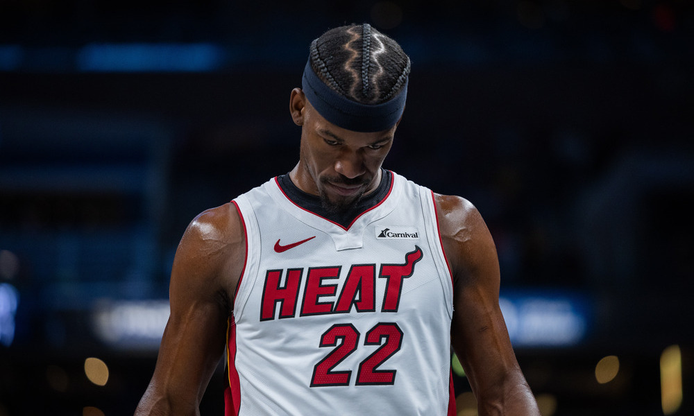 Jimmy Butler looks to the floor as he catches his breath during a stoppage of play