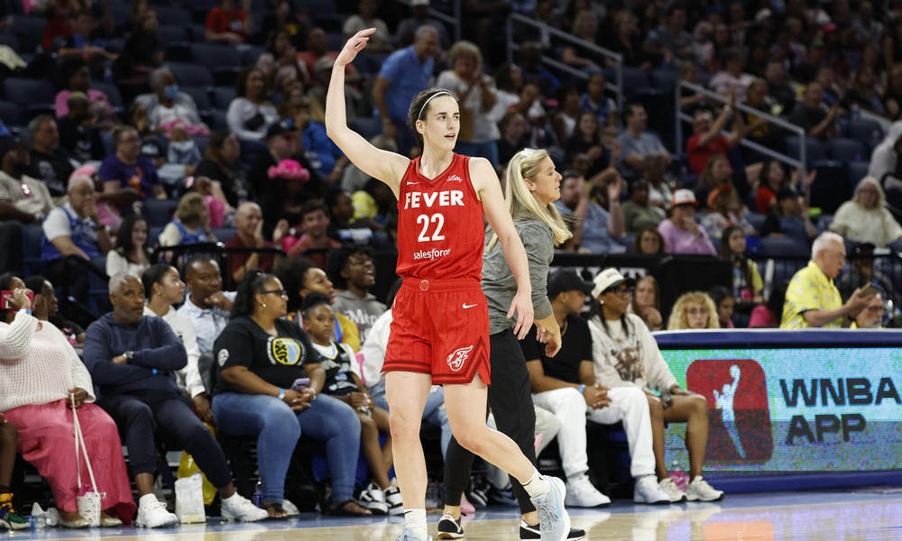 Caitlin Clark gets the crowd involved after sinking a shot