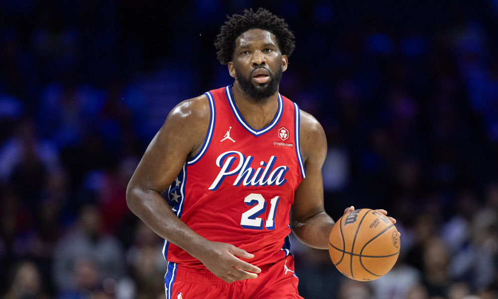Joel Embiid dribbling the ball up the floor