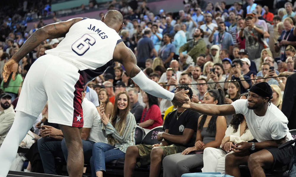 LeBron James shaking hands with his son Bronny at the 2024 Paris Olympics