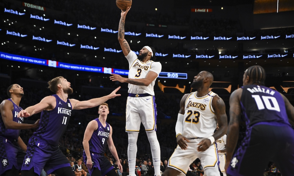 Los Angeles Lakers forward Anthony Davis (3) shoots against Sacramento Kings forward Domantas Sabonis (11) during the second half at Crypto.com Arena.