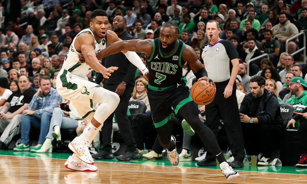 Jaylen Brown driving past Giannis Antetokounmpo