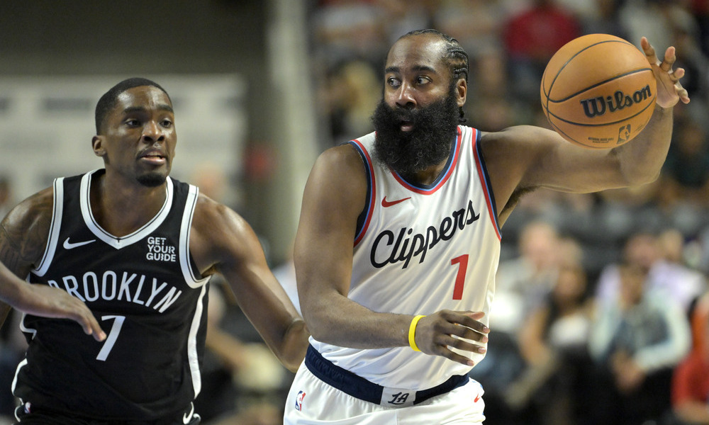 James Harden catching the ball during a preseason game