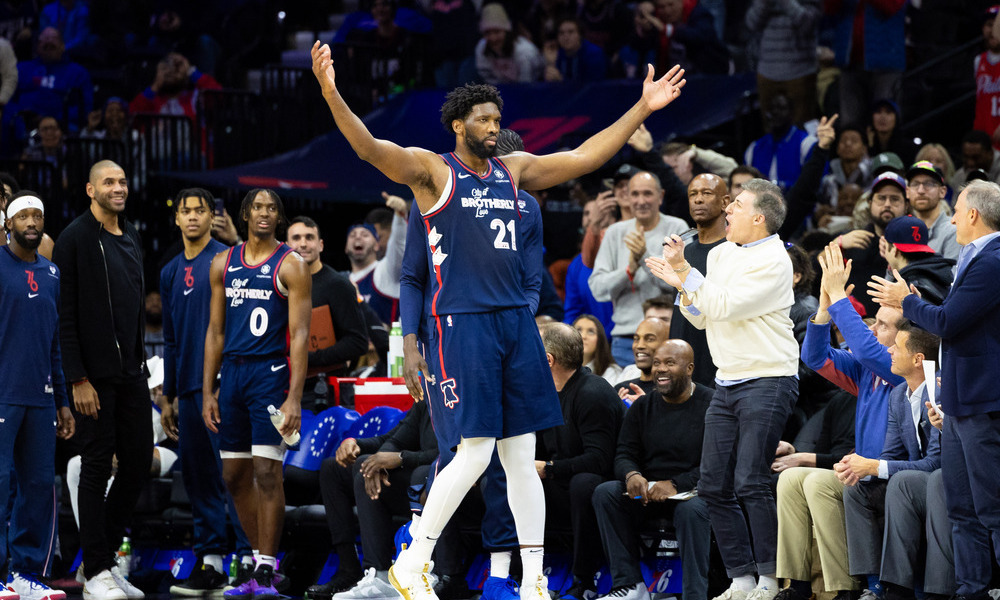 Joel Embiid hypes up the crowd at the end of a victory.