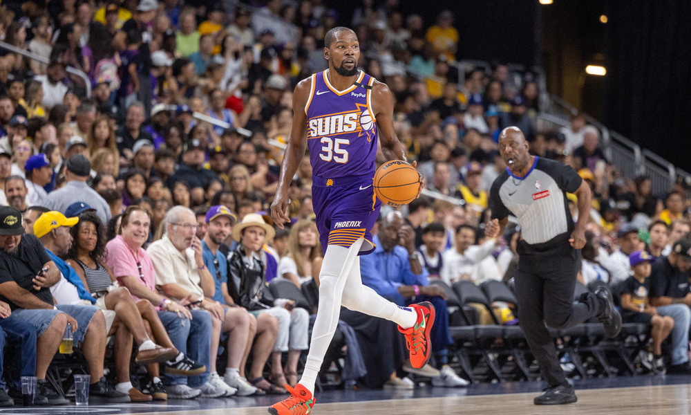 Kevin Durant dribbling the ball up the court