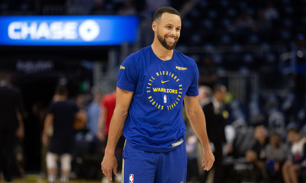 Steph Curry laughing during pregame warmups
