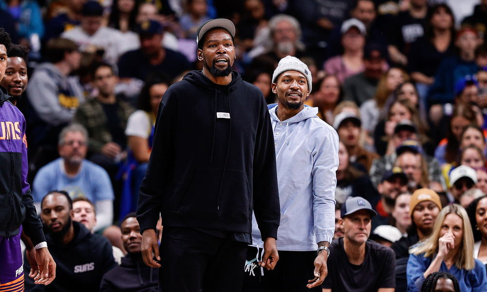 Kevin Durant and Bradley Beal watching their team from the sideline
