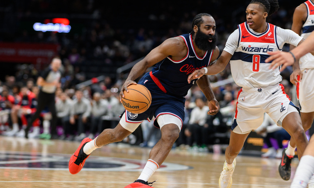 James Harden attempting to drive past his defender to the basket.