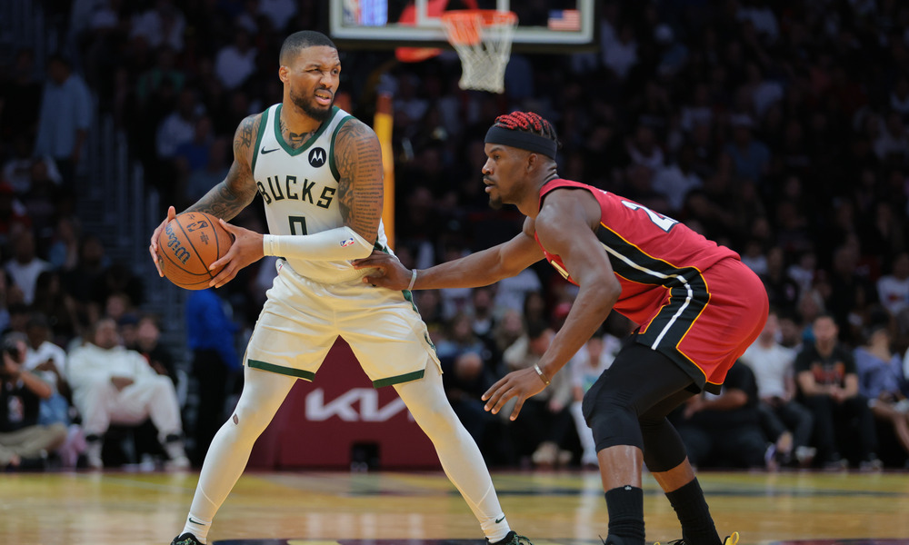 Damian Lillard sizing up his defender, Jimmy Butler.