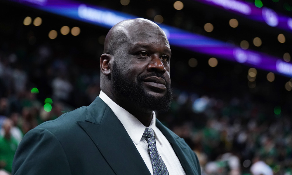 A closeup image of Shaquille O'Neal sitting courtside