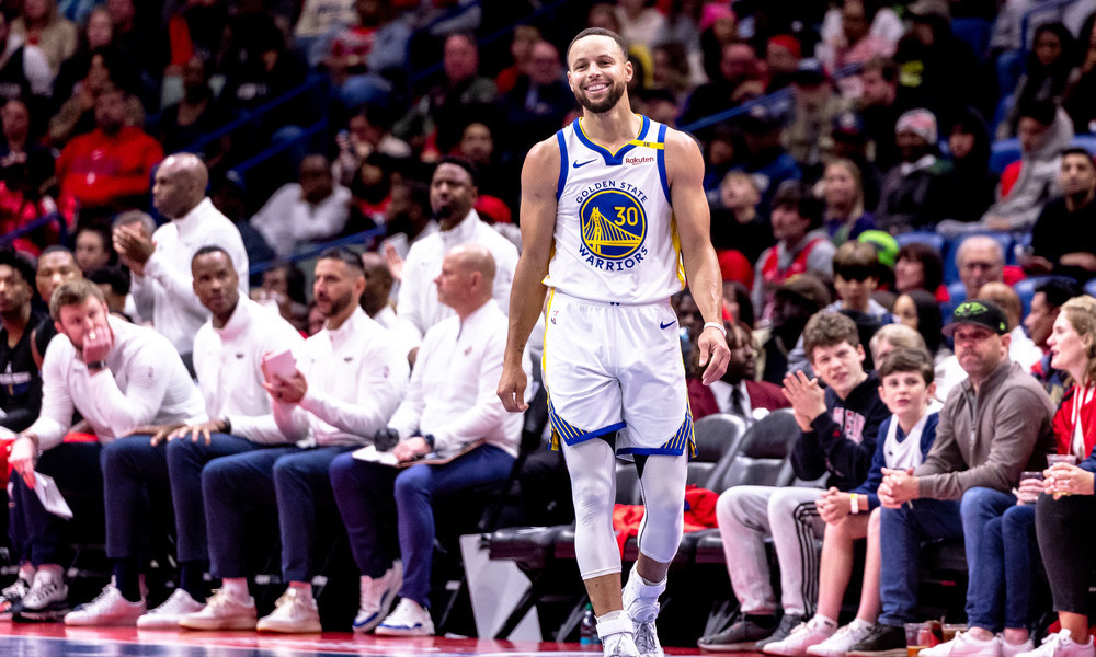 Stephen Curry smiling after a play