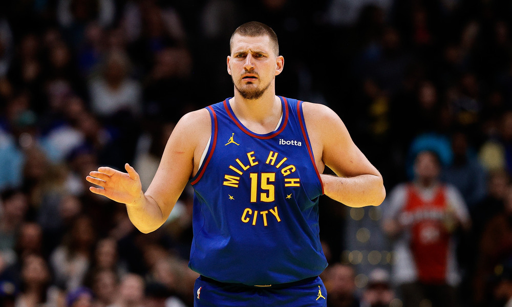 Nikola Jokic looking at his teammates during a stoppage of play.