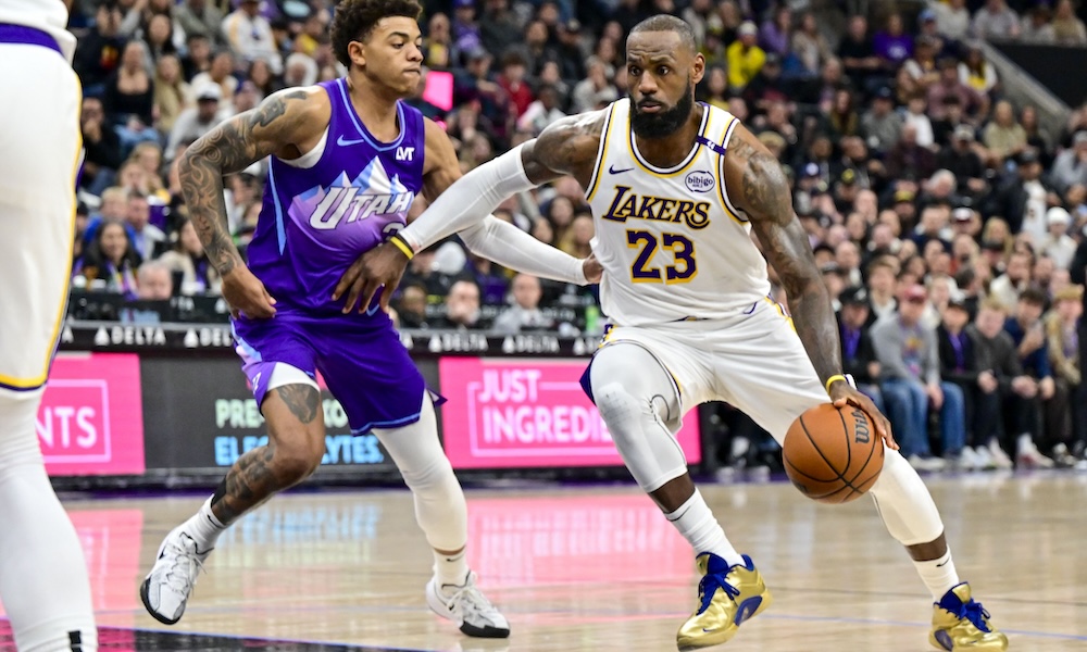 Los Angeles Lakers forward LeBron James (23) drives towards the basket around Utah Jazz guard Keyonte George (3) during the second half at the Delta Center.