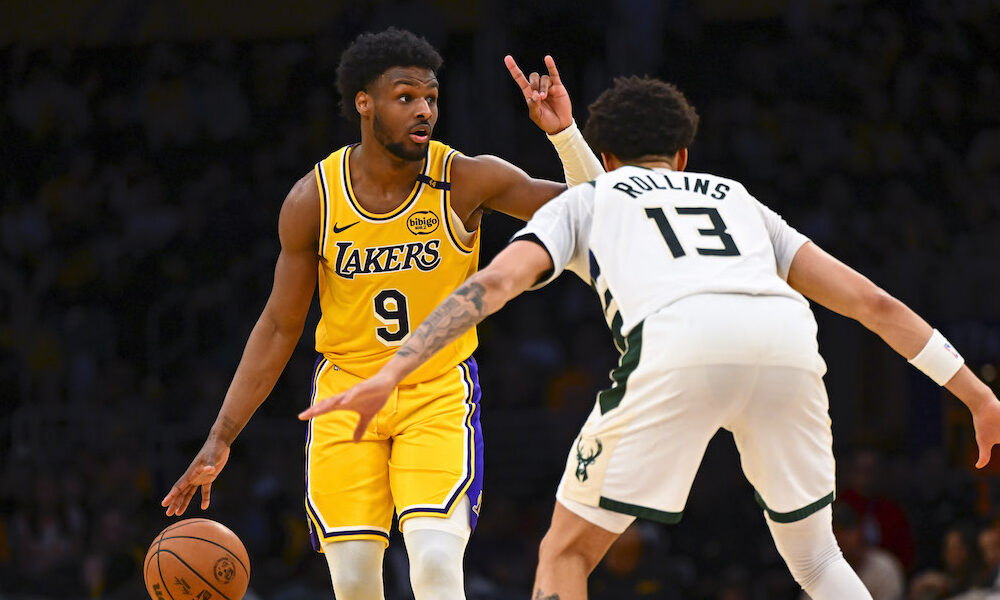 Lakers guard Bronny James handling the ball on the court in Thursday's game against the Bucks.