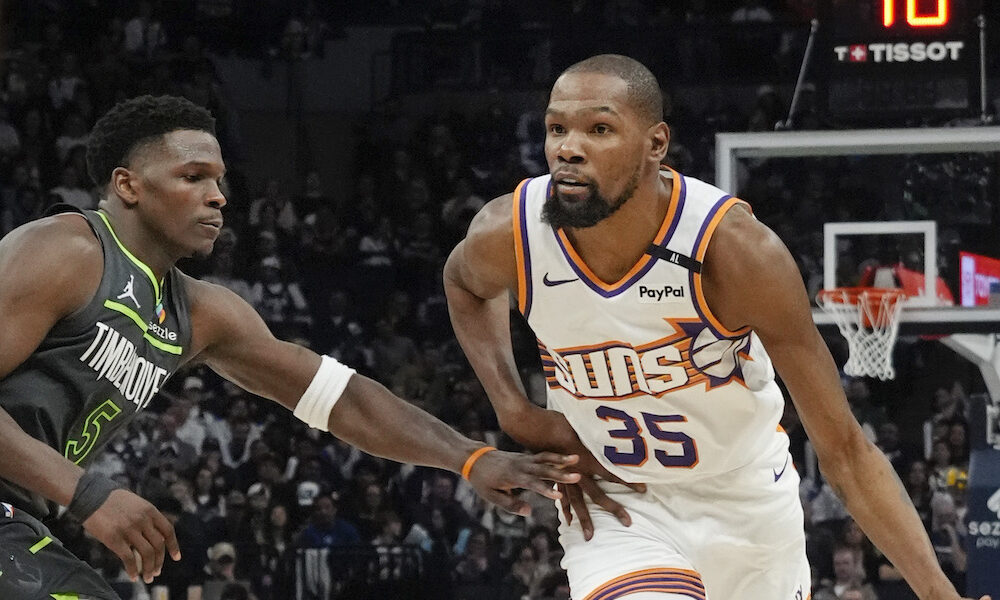 Suns' forward Kevin Durant drives pass T'Wolves defender Anthony Edwards in 2025 matchup