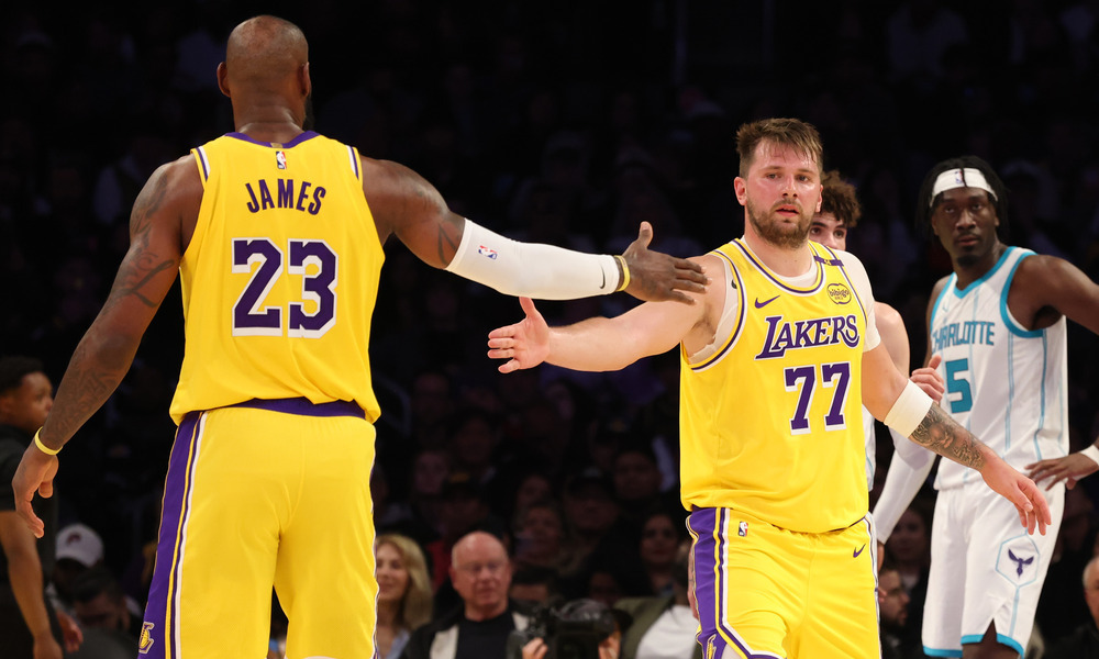 LeBron James and Luka high-five after a play.