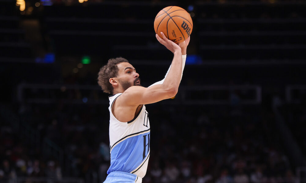 Haws' PG Trae Young attempts a 3-pointer in Sunday's matchup versus 76ers.