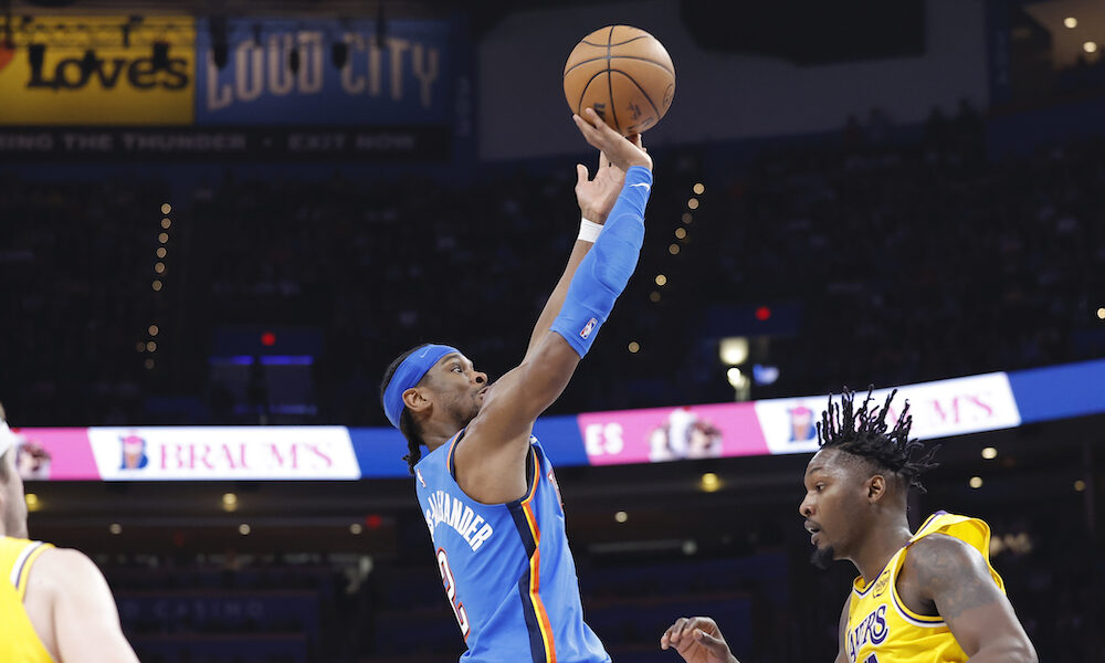 Thunder guard Shai Gilgeous-Alexander attempts a shot versus Lakers in 2025 game.