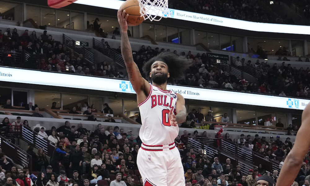 Bulls guard Coby White drives to the basket for a layup in Thursday's matchup against the Raptors.