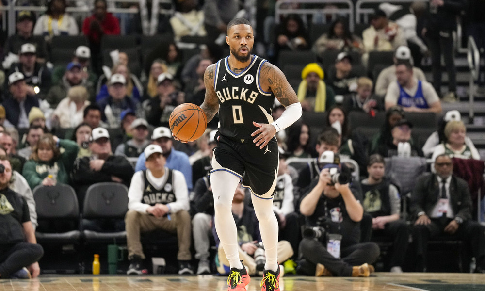 Damian Lillard dribbling up the open court.