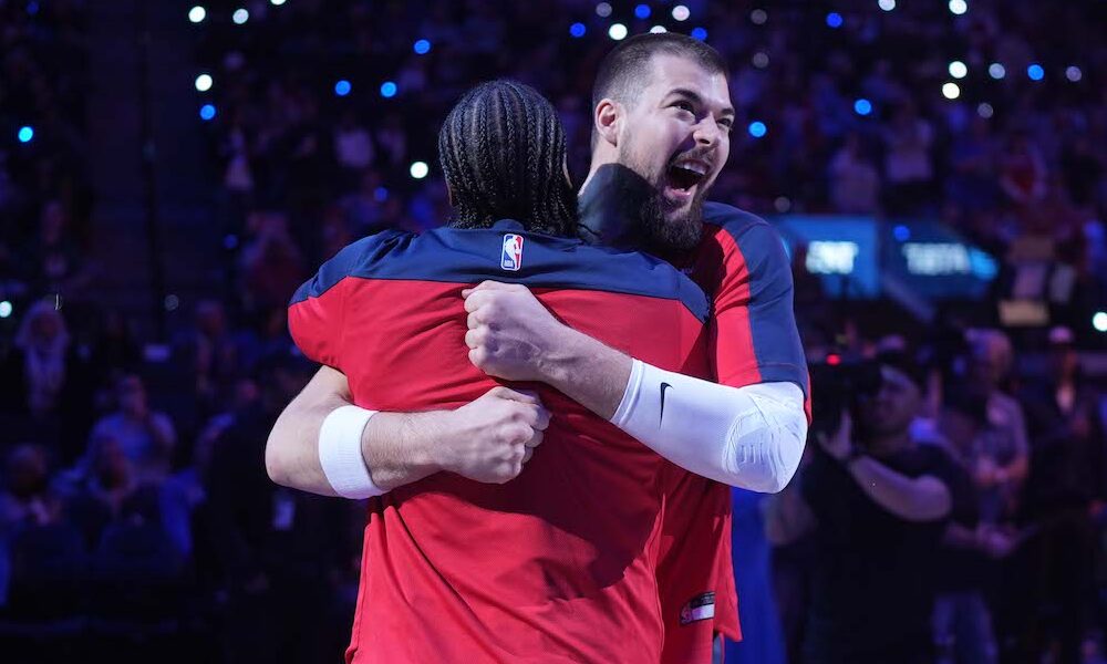 James Harden and Ivica Zubac embrace in matchup for Clippers versus Bucks.