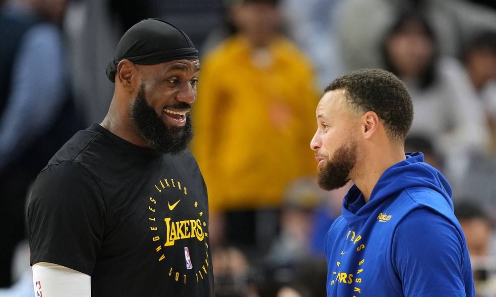 LeBron James and Steph Curry conversating pregame.