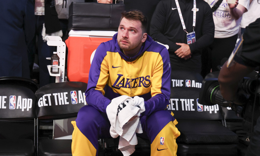 Luka Doncic looks up in tears as he watches his Dallas Mavericks' tribute video ahead of tipoff.