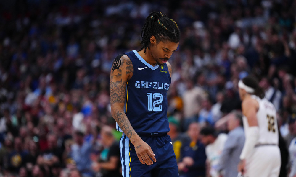 Ja Morant drops his head after missing a shot.