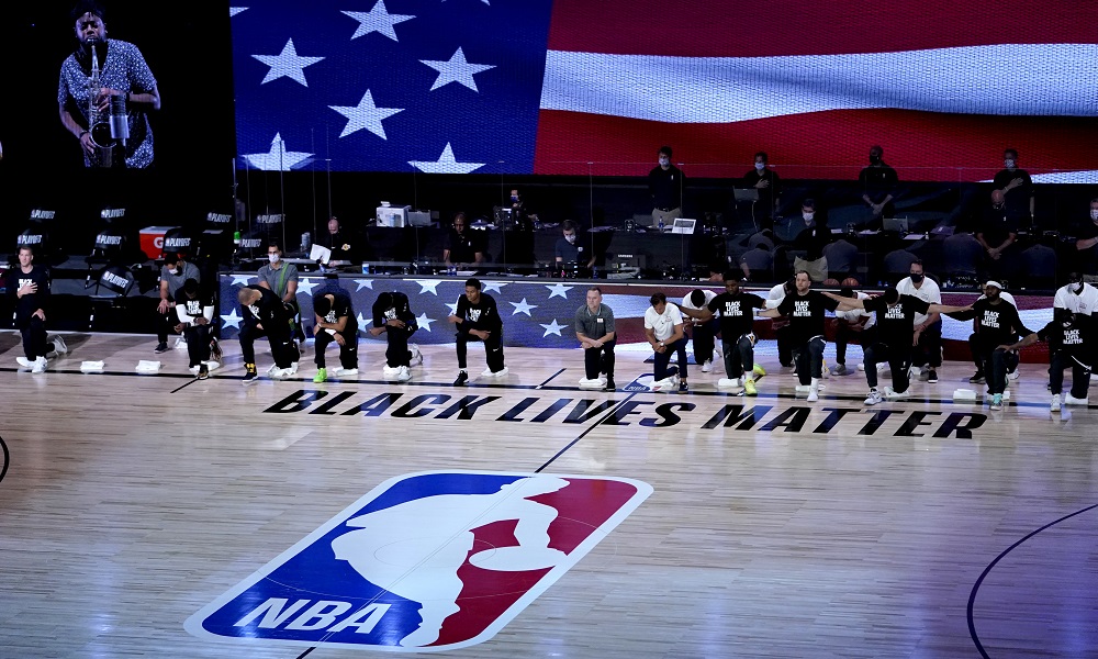 NBA players kneel before game