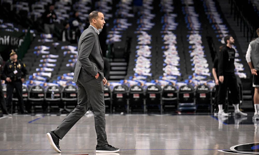 Nico Harrison walking across the court before a home game.