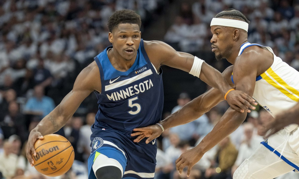 Anthony Edwards attempts to drive past Jimmy butler during Game 2.