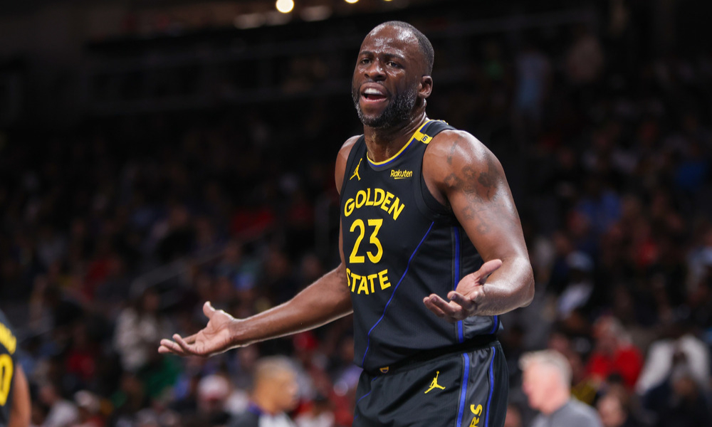 Draymond Green arguing with an official after a foul call.
