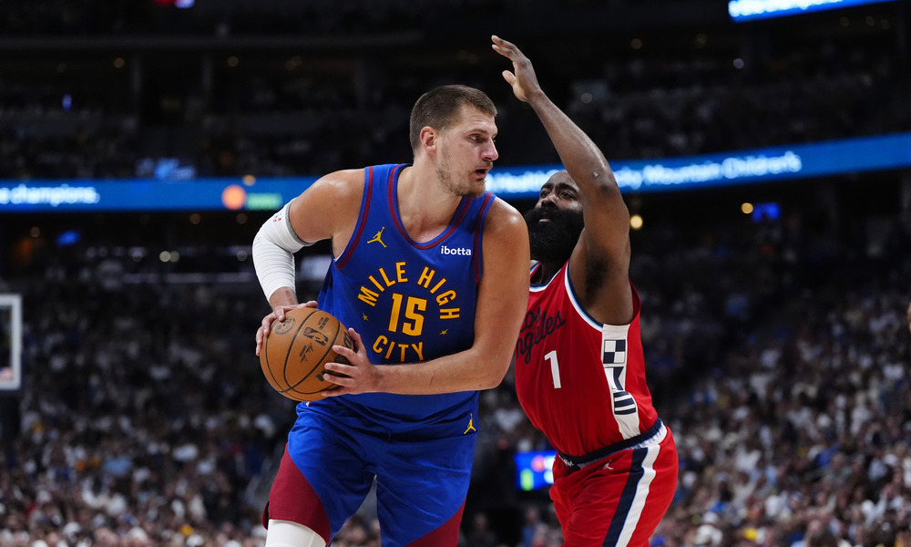 Nikola Jokic posts up against James Harden.