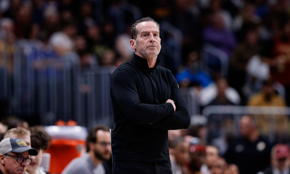 Kenny Atkinson watches as a play unfolds.