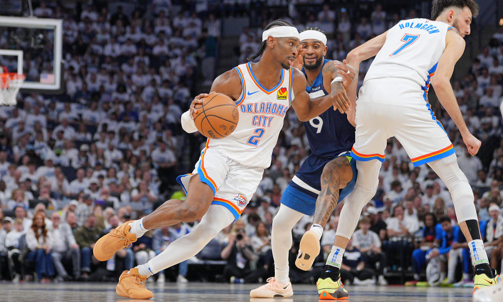 SGA dribbling past his defender during Game 4 of the Western Conference Finals.