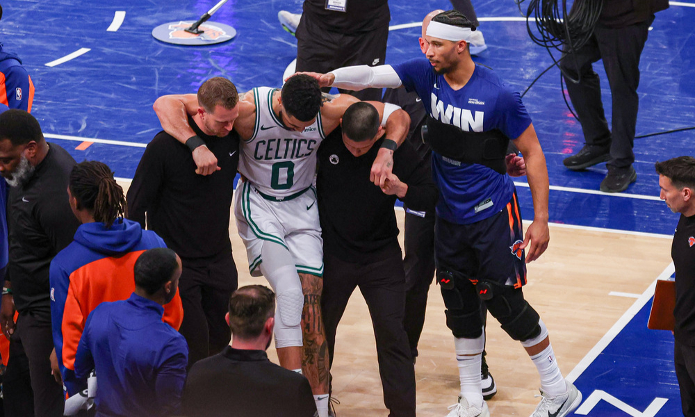 Jayson Tatum is helped off the court after sustaining an injury in Game 4.