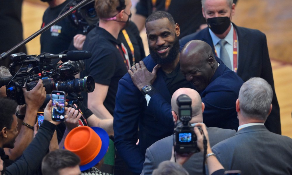 Michael Jordan and LeBron James embrace at 75 anniversary.