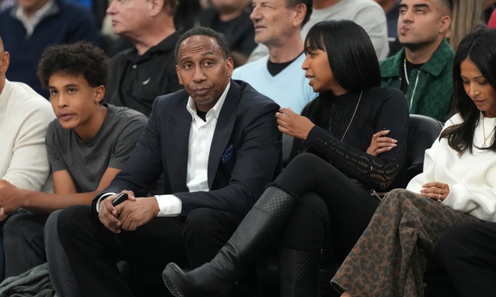 Stephen A. Smith watches a game