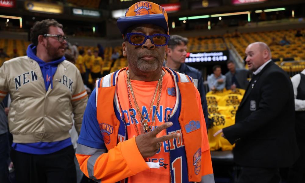 Spike Lee wears his Knicks hat and apparel during a game