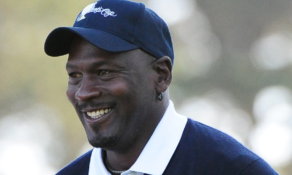 Michael Jordan smiles at golf event.