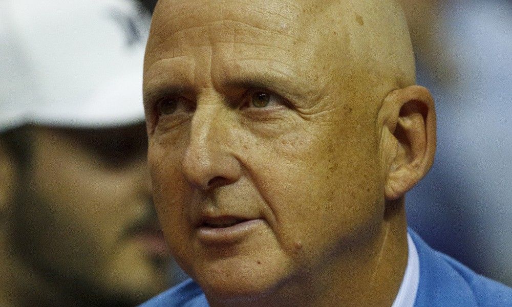 Michael Jordan’s former agent, David Falk, watches a game