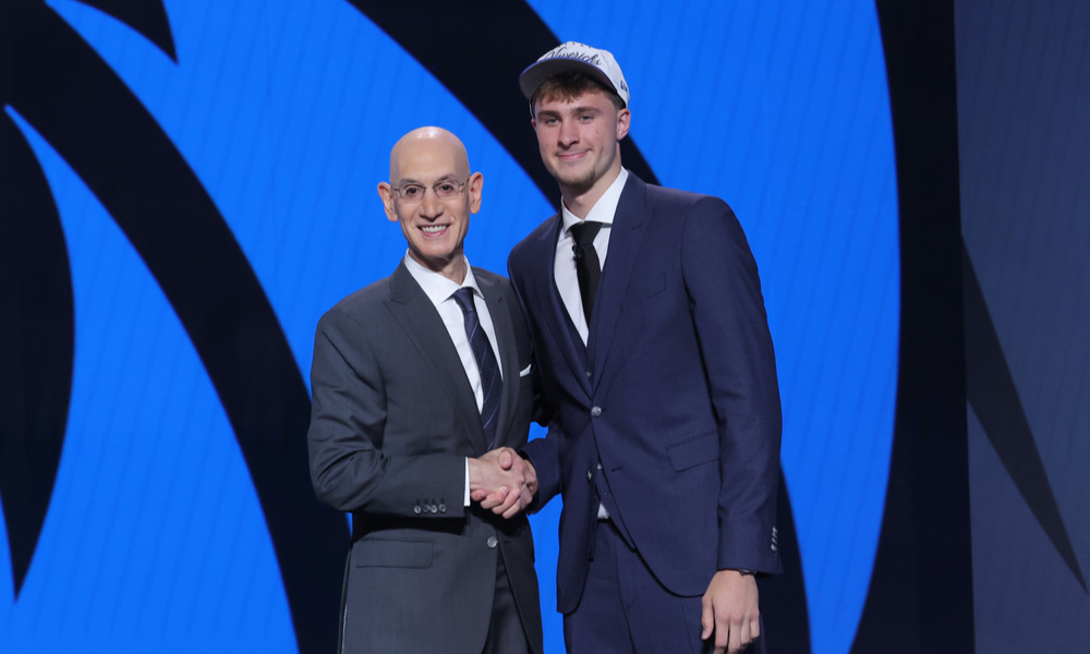 Cooper Flagg shakes hands with Adam Silver as he's selected by the Dallas Mavericks in the 2025 NBA Draft.