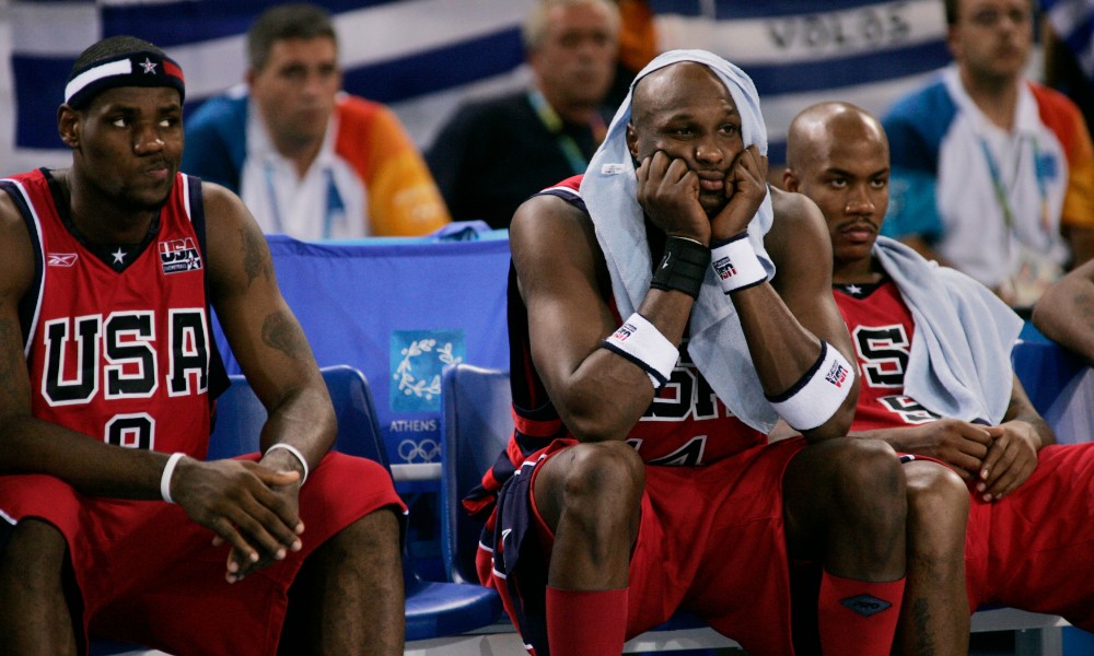 Lamar Odom watches the game from the bench